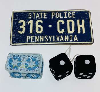 Lot 432 - World War Z (2013) - Dashboard Dice, Tissue Holder and License Plate from Opening Attack