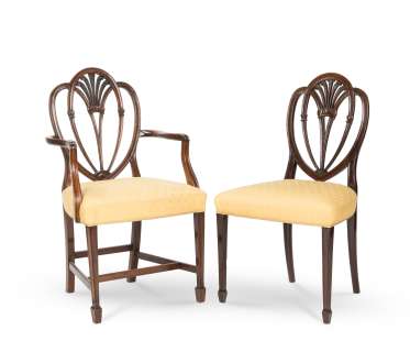 The Crown | A set of twelve mahogany dining chairs, including a pair of armchairs, in the George III styleFirst seen in Season 2, in the Buckingham Palace Corridor set (12) | Bonhams
