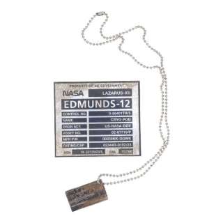 INTERSTELLAR (2014) - Lot #155 : Dr. Wolf Edmunds‘ Grave Plaque and Dog Tag