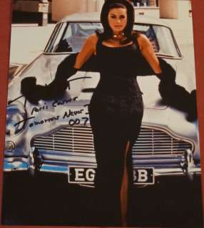 James Bond 007: Tomorrow Never Dies - Teri Hatcher as Paris Carver" with Aston Martin DB5, signed with Certified Genuine bc holographie | Catawiki