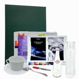 Lot #170: Challengers Tashi Screen Used Aston Martin Paperwork, Marker, Coffee Cup, Plate, Spoon & Water Bottle Set Sc 4 – 7