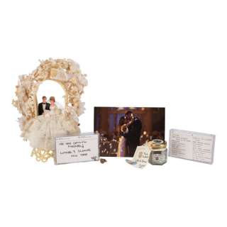 UMBRELLA ACADEMY, THE (2019-2024) - Lot #148: Luther (Tom Hopper) and Sloane‘s (Genesis Rodriguez) Wedding Cake Topper, Ring and Accessories