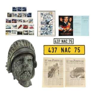 JAMES BOND: GOLDENEYE (1995) - Lot #1341 : Xenia Onatopp‘s (Famke Janssen) Ferrari Number Plates, Statue Head, Newspapers, and Production Ephemera