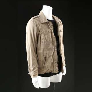 Breaking Bad | Jesse Pinkman’s (Aaron Paul) “Crawl Space” Khaki Field Jacket and Long Sleeve Black Shirt Lot | Propstore
