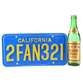 BIG TROUBLE IN LITTLE CHINA (1986) - Lot 535 - Jack Burton‘s (Kurt Russell) License Plate and Beer Bottle