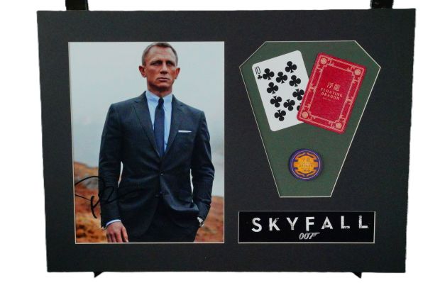 Lot 31 - Skyfall-Prop Casino Chip, Daniel Craig Signed Photo | GWS Auctions