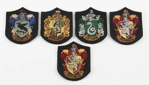 Lot 2313 - Harry Potter - Five original production made student robe badges, two for Gryffindor, one…