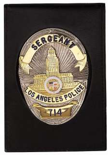 Lot 611 - Dan Aykroyd screen-used "Sgt. Joe Friday" Police Badge in wallet with business card from Dragnet.