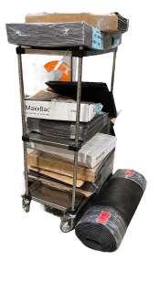 Rack lot full of carpet tiles / rubber mat roll & area rug (from The Good Doctor show) Rack NOT incl | Direct Liquidation