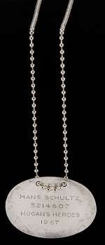 Lot 663 - John Banner Sgt. Schultz dog tag & chain Hogan‘s Heroes