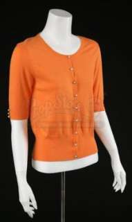 Dexter - Lot 50 - S7 E02: SUNSHINE AND FROSTY SWIRL - Maria LaGuerta’s (Lauren Luna Velez) Orange Cardigan Sweater