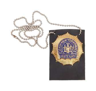 Lot 646 - Die Hard with a Vengeance | Bruce Willis "John McClane" NYPD Necklace Badge Prop with Photo