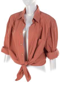 Lot 1399 - Laura Dern ‘Ellie Sattler‘ signature shirt and boots from Jurassic Park.