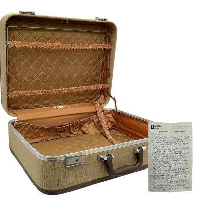 Lot 35: Eternity Larry (Miles Teller) Screen Used Folded Letter & Suitcase | VIP Fan Auctions