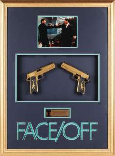Lot 1073 - Nicholas Cage pair of gold stunt pistols from Face/Off