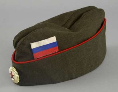 Mission Impossible (1996) An khaki green army cap made for Tom Crusie, with central soviet emblem and red ribbon… | Ewbank’s