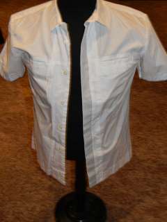 Hunger Games white shirt worn by one of the game controllers, it has faint marks from various actor | Piece of the Past