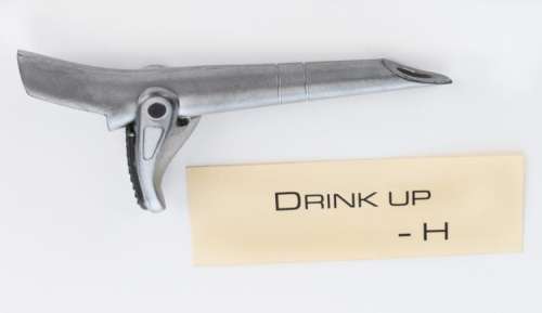 Spile prop and "Drink Up - H" note sent to "Katniss" from The Hunger Games: Catching Fire. | Profiles in History