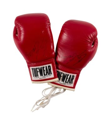 Rocky IV | Lot #428 - Signed Sylvester Stallone ("Rocky Balboa") Gloves, with Award and Memorabilia | Julien’s