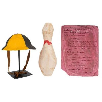 Flintstones, the (1994) | Barney Rubble’s (Rick Moranis) Crash Helmet and Joe Rockhead’s (Irwin Keyes) Pink "Slab" with Bowling Pin | Propstore