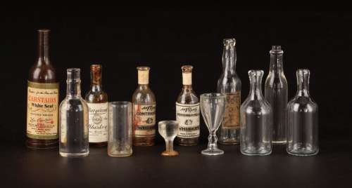 Lot 148 - Miniature (12) liquor bottles and glasses from the Golden Safari nightclub in Mighty Joe Young.