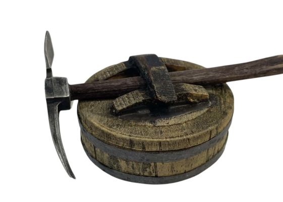 Lot 183 - Indiana Jones and the Temple of Doom (1984) - ILM Miniature Pickaxe And Barrel Lid | Hanlin Auction Service