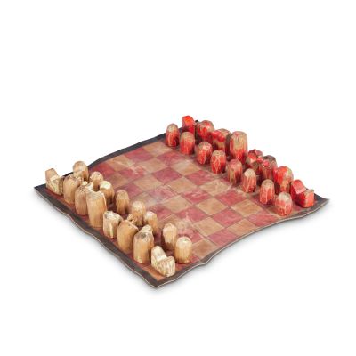 Lot 216 - A stained leather and carved wood chess set created by the Set Decoration Department | Bonhams