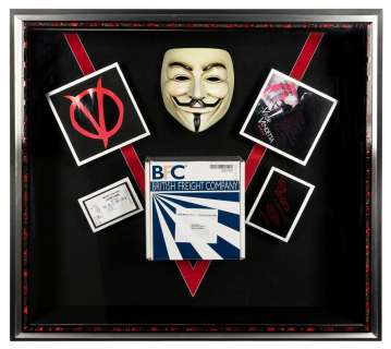 Lot 117 - Screen-Used Crowd Mask and Package Display from V for Vende...