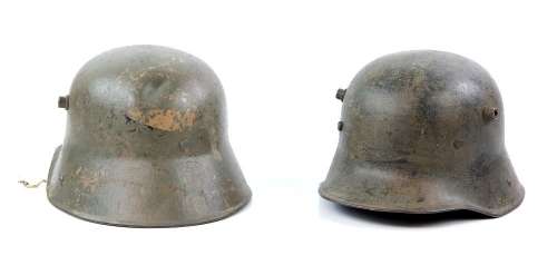 Two WWII steel helmets from various productions, Western Costume Co. barcode labels present. | Ewbank’s