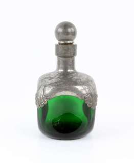 Lot 1436 - The Lord of the Rings - green glass and metal vessel with metal and cork stopper, used as set…