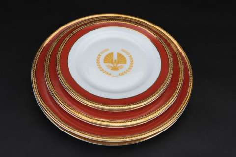 Lot 157 - "President Snow" Panem branded (2) 5-piece dinnerware sets from The Hunger Games: Mockingjay - Part 2.