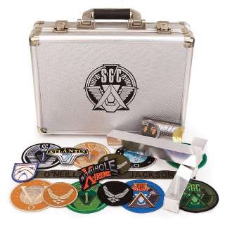 Lot 224 - Screen-used Trinium briefcase and collection of uniform patches from Stargate SG-1.