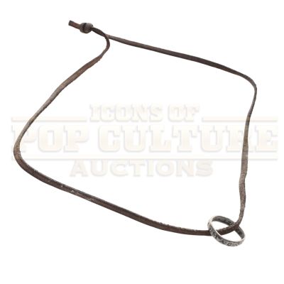 Lot 33 - Uncharted – Nathan Drake’s (Tom Holland) Necklace – 58-8 | Icons of Pop Culture