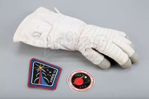 THE MARTIAN (2015) - Lot 525 - Mark Watney‘s (Matt Damon) "Iron Man" Cut Glove and Ares IV Mission Patch and Decal