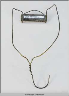 Lot 106 - Harmonica and Harmonica Holder {David Carradine}