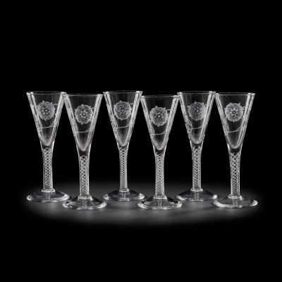 Lot 29 - A matched set of six etched and air-twist clear glass wine goblets, in the 18th century Jacobite style Made by The Glassmakers, for Season 2 (6) | Bonhams