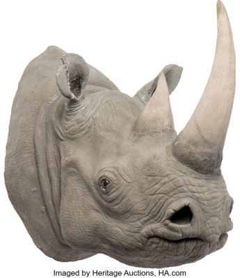 Ace Ventura: When Nature Calls (Warner Bros., 1995), Mounted Rhinoceros Head and "Shikaka" Bat Totem Pole Segment. (Total: 2)