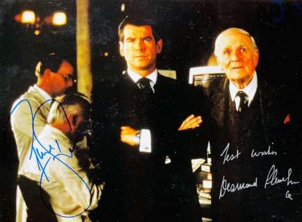 James Bond 007: Tomorrow Never Dies - Double signed by Pierce Brosnan (007) and Desmond Llewelyn (+) as "Q" - with COA