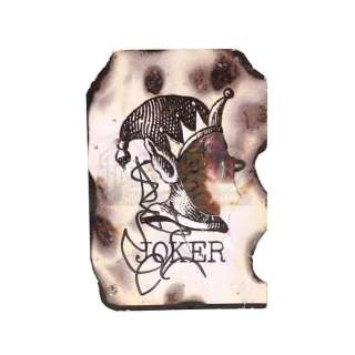 THE DARK KNIGHT (2008) - Lot 69 - Heath Ledger Autographed Scorched Joker Card