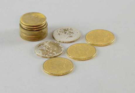 Sahara (2005) Three foreground gold coloured coins together with a group of background coins made… | Ewbank’s