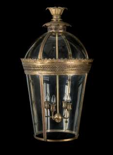 The Crown | A large pair of 20th century gilt metal lanterns First seen in Season 2, for the porte cochère of the Buckingham Palace exterior set (2) | Bonhams