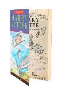 HARRY POTTER AND THE CHAMBER OF SECRETS (2002) - Lot 318 - Daniel Radcliffe and Cast Autographed Paperback Book