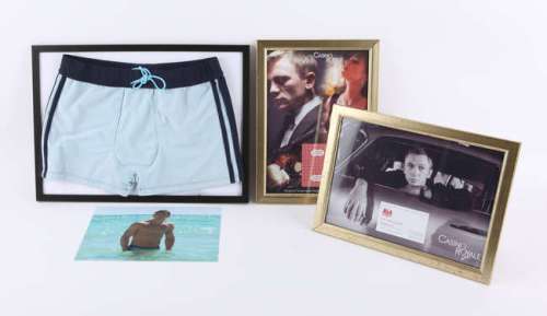 Lot 4493 - James Bond - Replica props including Casino Royale Vesper Lynd business card, Daniel Craig Trunks…