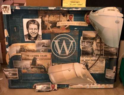 "Snowpiercer" Season 2 Tea Room - Wooden framed Wilford’s shrine (approx. 42in x 32in) | Direct Liquidation