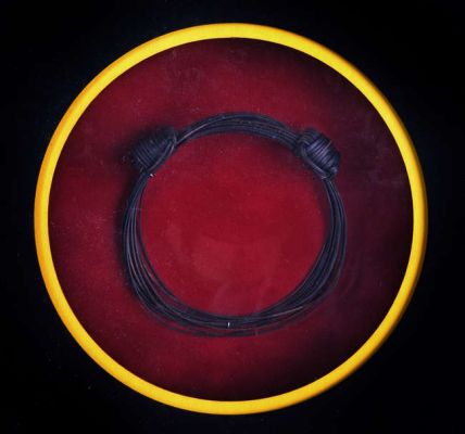 Lot 5010 - Jurassic Park (1993). Wristband prop, ‘elephant hair‘ wristband, as worn on screen by Bob Peck who…