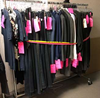 "Superheroes Show" rack full of assorted Hero’s wardrobe - includes t-shirts/ denim jeans/ 2pc suits | Direct Liquidation