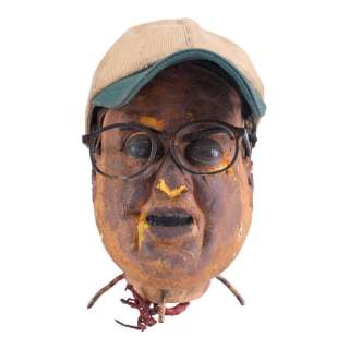 Team America: World Police (2004) | Michael Moore’s (Trey Parker) Scorched Puppet Head and Suicide Accessories | Propstore