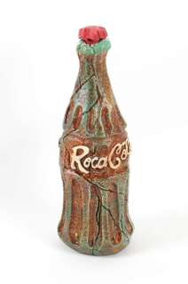 Flintstones Roca Cola bottle with red screw top animation prop. 33cm tall by 12cm base diameter. | Ewbank’s