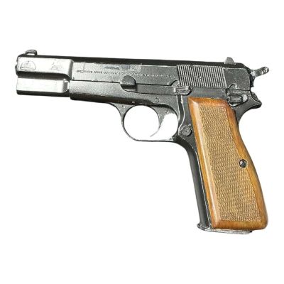 Lot 89: Marty Supreme Mishkin Screen Used Prop Non-Functional Solid Plugged Browning 9mm Pistol | VIP Fan Auctions