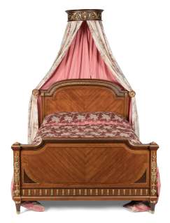 The Crown - Lot 116 - Claire Foy, Olivia Colman & Imelda Staunton (as the Queen): a French kingwood and gilt-metal mounted bed, in the manner of Louis XVIFirst seen in Season 1, in the Queen‘s Bedroom set